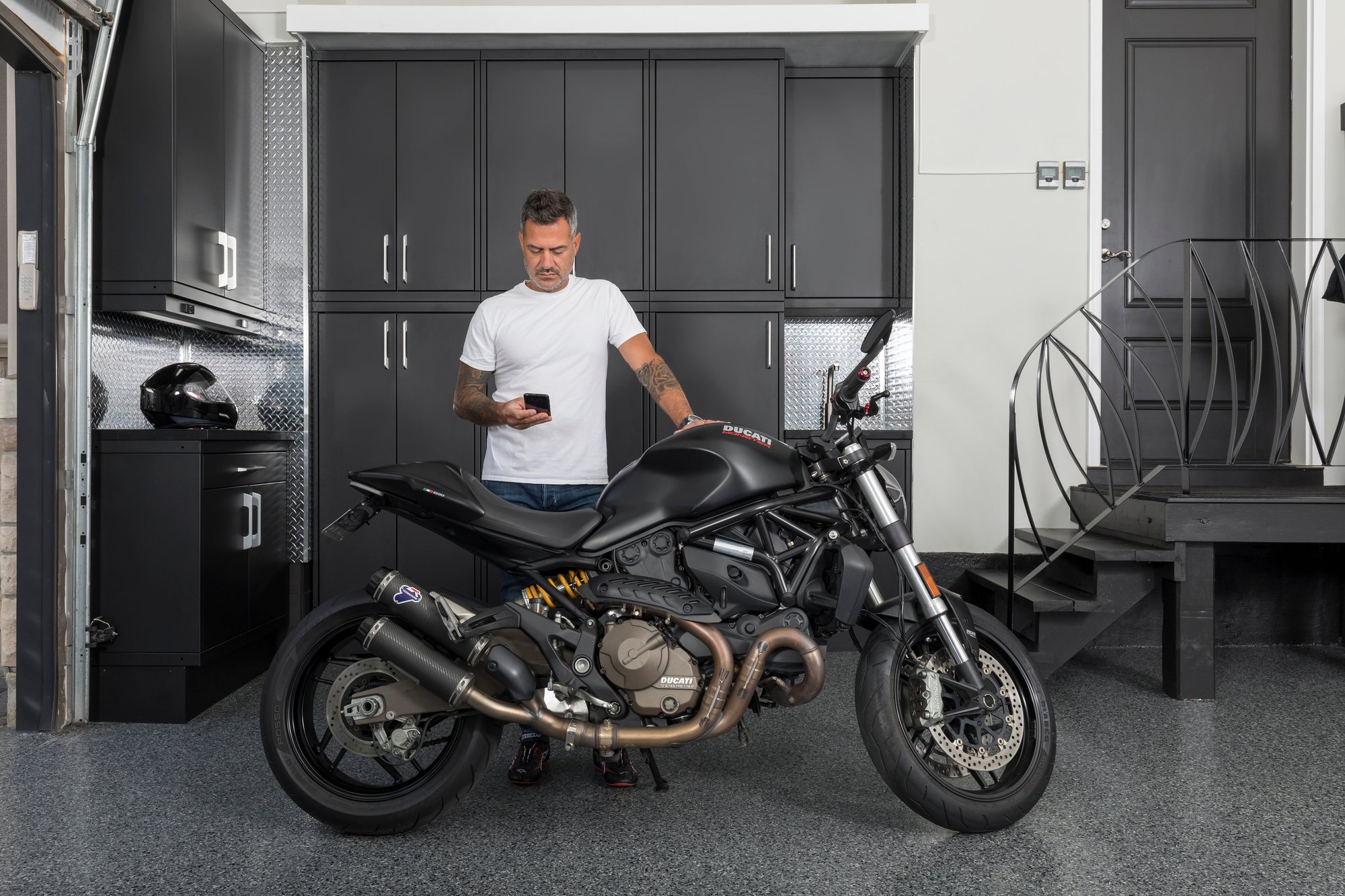 Motorcycle in a luxury garage by Garage Living