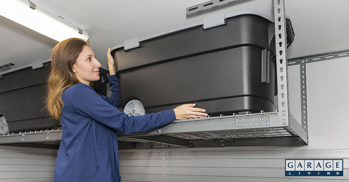 woman putting storage bin in rack
