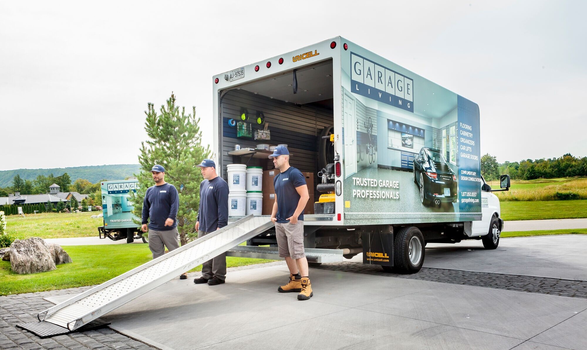 Our pro garage renovators are unloading the work truck to start remodeling a client's garage.