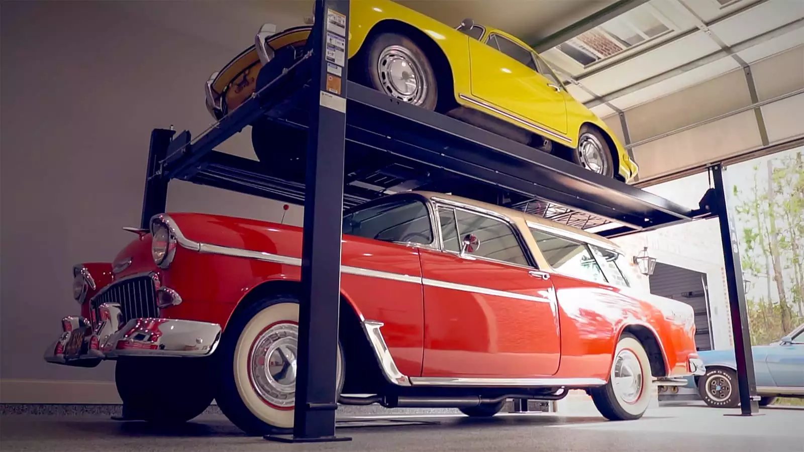 Two classic cars in Garage Living Car Lifts