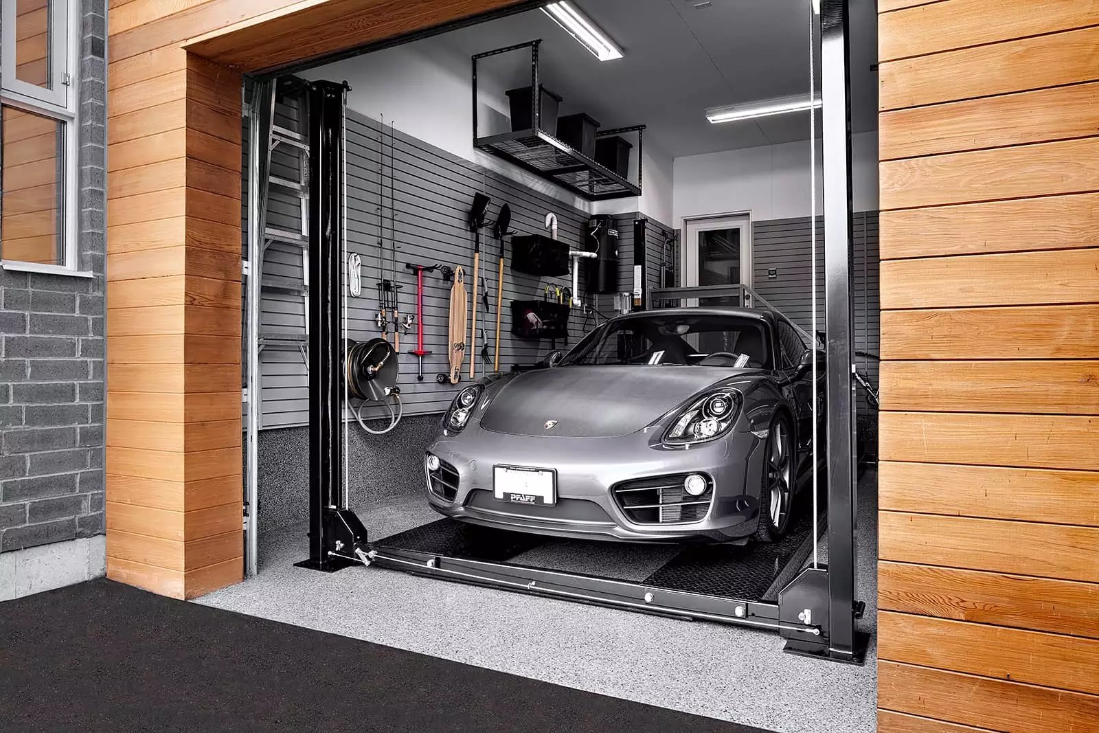 Silver Porsche Car Lift down by Garage Living