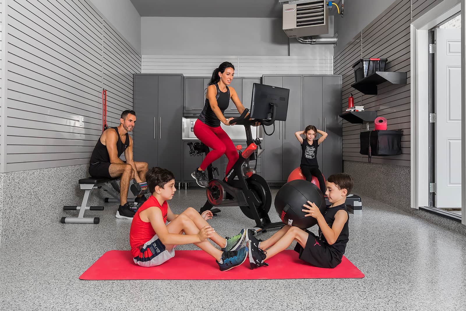 Family workout- The Fitness Room Garage - Garage Living