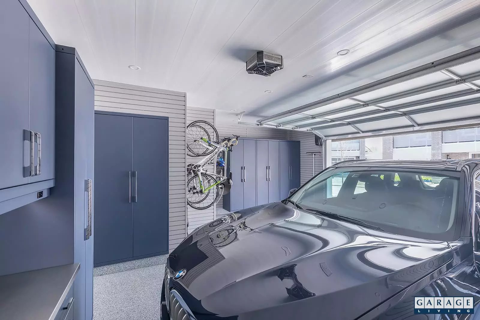 Harbor Blue Garage with parked BMW and bike storage - Garage Living